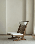 Nakajima George Reclining Chair with hand-woven rattan and teak wood frame, offering a romantic and elegant design for interiors.