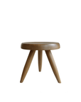 Meribel Stool made of imported teak wood, featuring a soft architectural design inspired by the Alps, with manual polishing finish.
