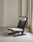 Nakajima George Reclining Chair in teak wood with rattan weave and natural linen, handmade for a romantic and elegant ambiance.