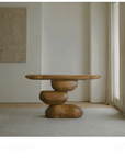Wabi-Sabi wood table with irregular structure in a retro style living room, showcasing natural aging and balancing life elements.