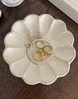 Elegant Rinka Plate 15cm showcasing jewelry, handcrafted porcelain by Kaneko Kohyo, adds style to any decor.