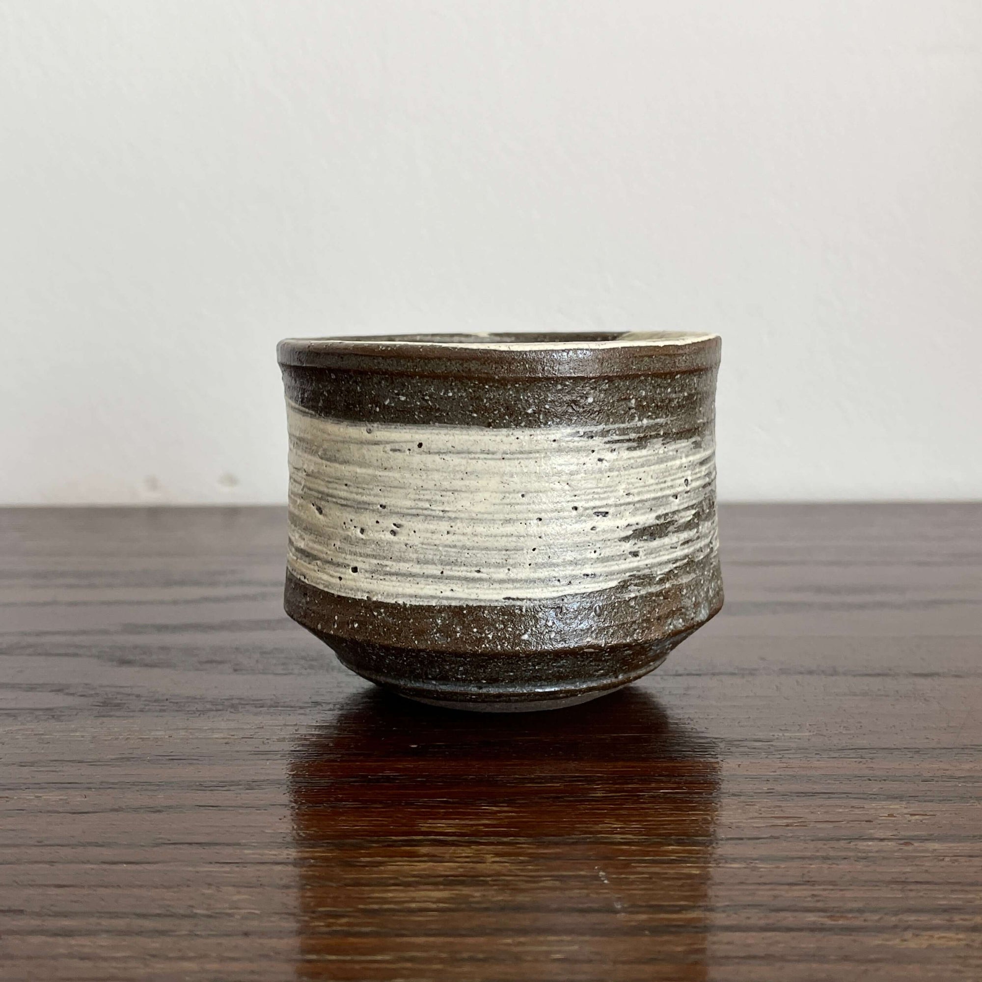 Wabi-Sabi Matcha Bowl on wooden surface, ceramic texture, ideal for Japanese tea, 9.8cm diameter x 7.7cm height. Made in Japan.