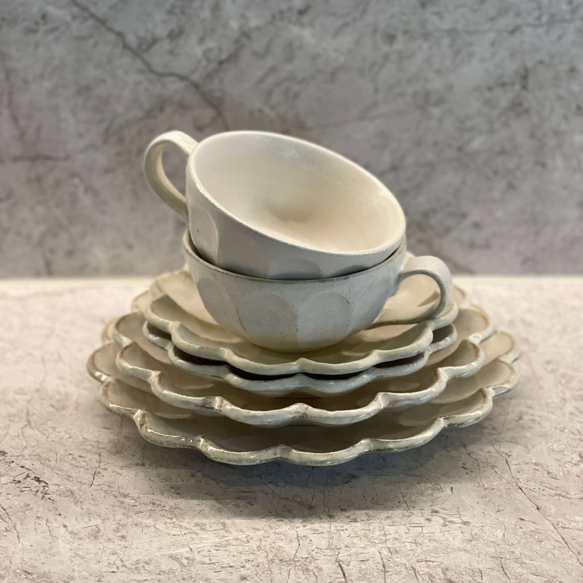 Elegant afternoon tea set featuring two soup cups and three white rinka plates, perfect for a refined dining experience.