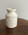 Elegant white vase from Yoshida Pottery Collection with nature-inspired patterns by Masakazu Yoshida, adding a refined touch to decor.