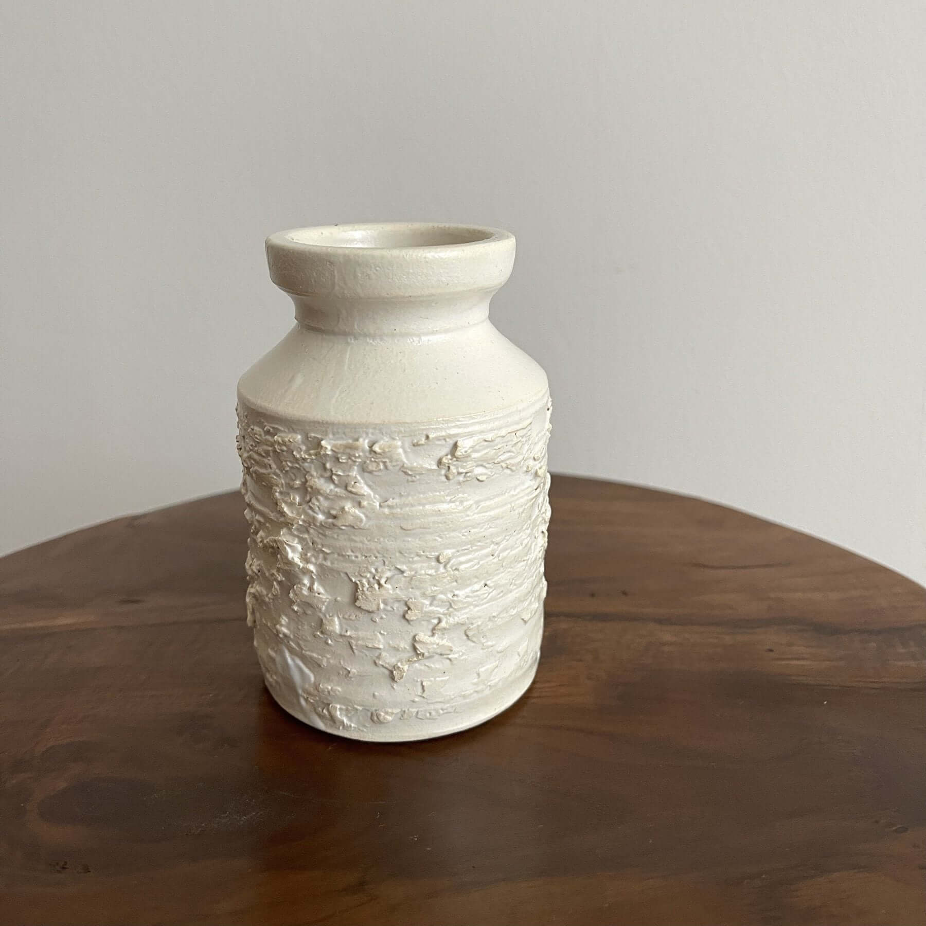 Yoshida White Vase from the Yoshida Pottery Collection, showcasing elegant texture and artisanal craftsmanship on a wooden table.