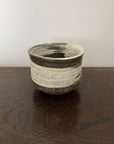 Ceramic Wabi-Sabi Matcha Bowl on wooden surface, Japanese design perfect for traditional matcha tea preparation.