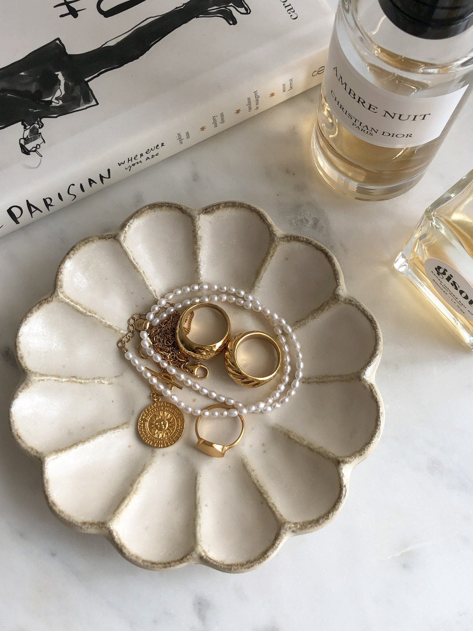 Elegant Rinka Plate with Jewelry Displayed Stylishly on a Tabletop with Perfume and Book Nearby