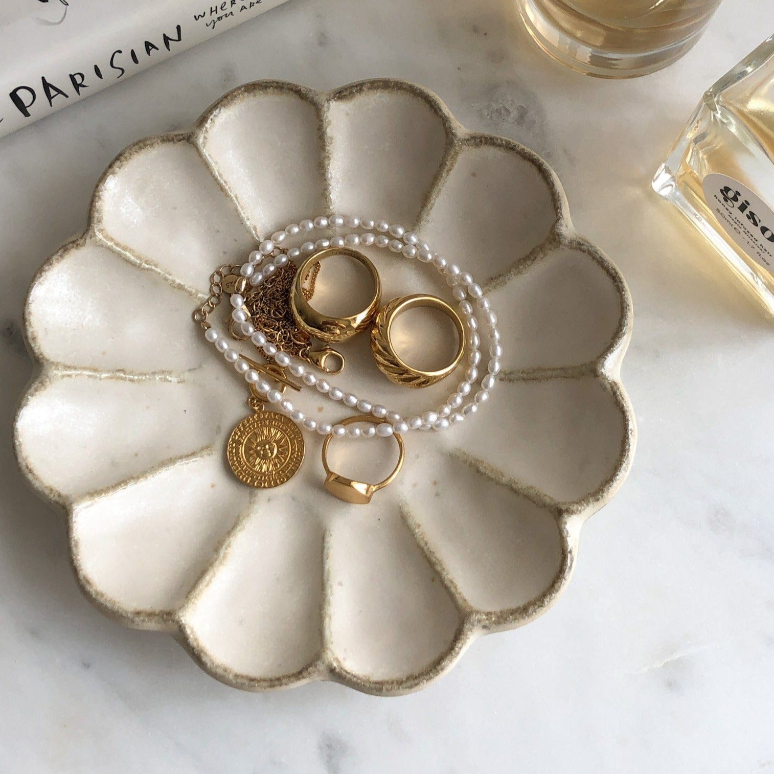 Rinka Plate 14cm showcasing jewelry display, handcrafted in Japan, with elegant porcelain design and scalloped edges.