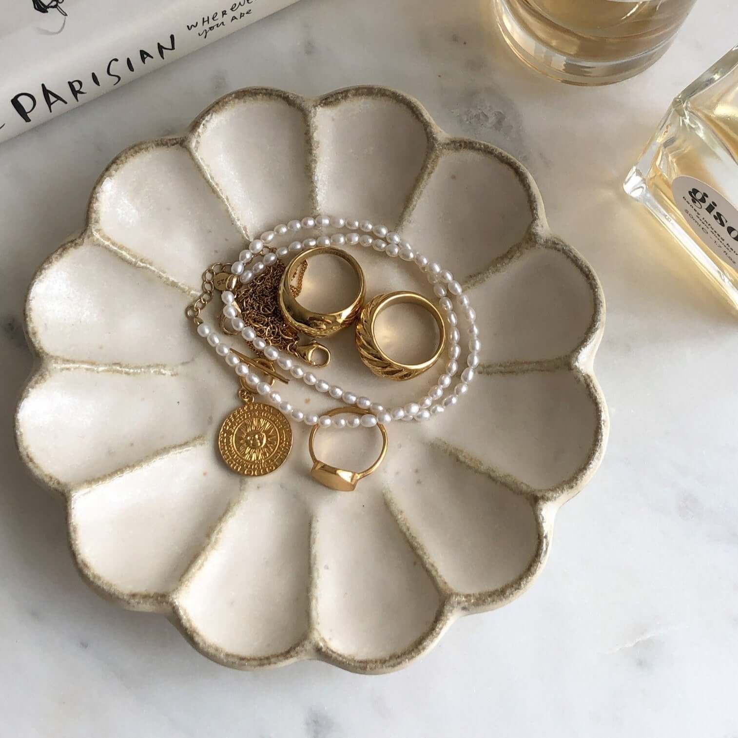 Elegant Rinka Plate by Kaneko Kohyo displaying gold jewelry and pearl necklace, handmade in Japan. Microwave and dishwasher safe.