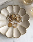 Elegant Rinka Plate by Kaneko Kohyo displaying gold jewelry and pearl necklace, handmade in Japan. Microwave and dishwasher safe.