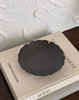 Elegant Yukiwa Plate by Yoshida Pottery on a table, showcasing its nature-inspired design and sophisticated charm.