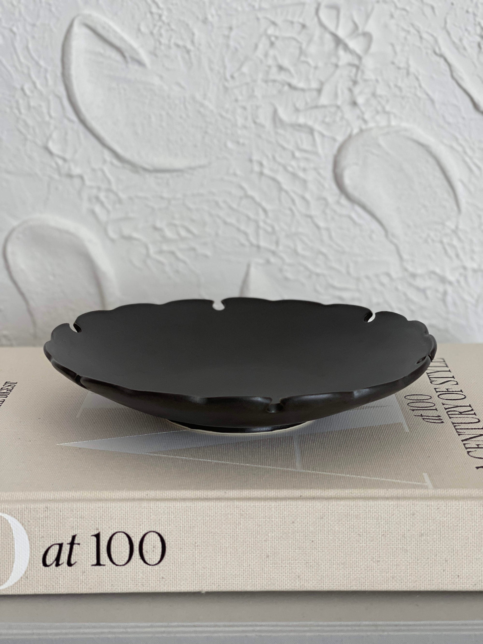 Yukiwa Plate by Yoshida Pottery, elegantly designed with nature-inspired patterns, displayed on a textured background.