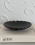 Yukiwa Plate by Yoshida Pottery, elegantly designed with nature-inspired patterns, displayed on a textured background.