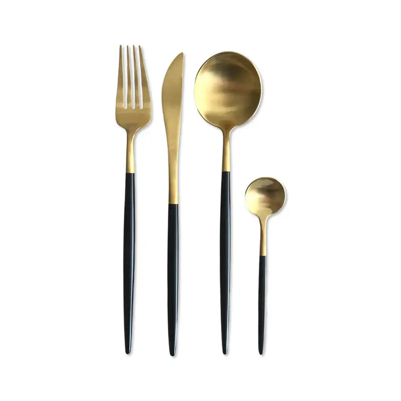 Elegant gold and black cutlery set with fork, knife, spoon, and teaspoon for stylish dining.