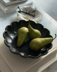 Porcelain Rinka Bowl 21cm with pears, showcasing its flower shape and elegance in a tabletop setting.