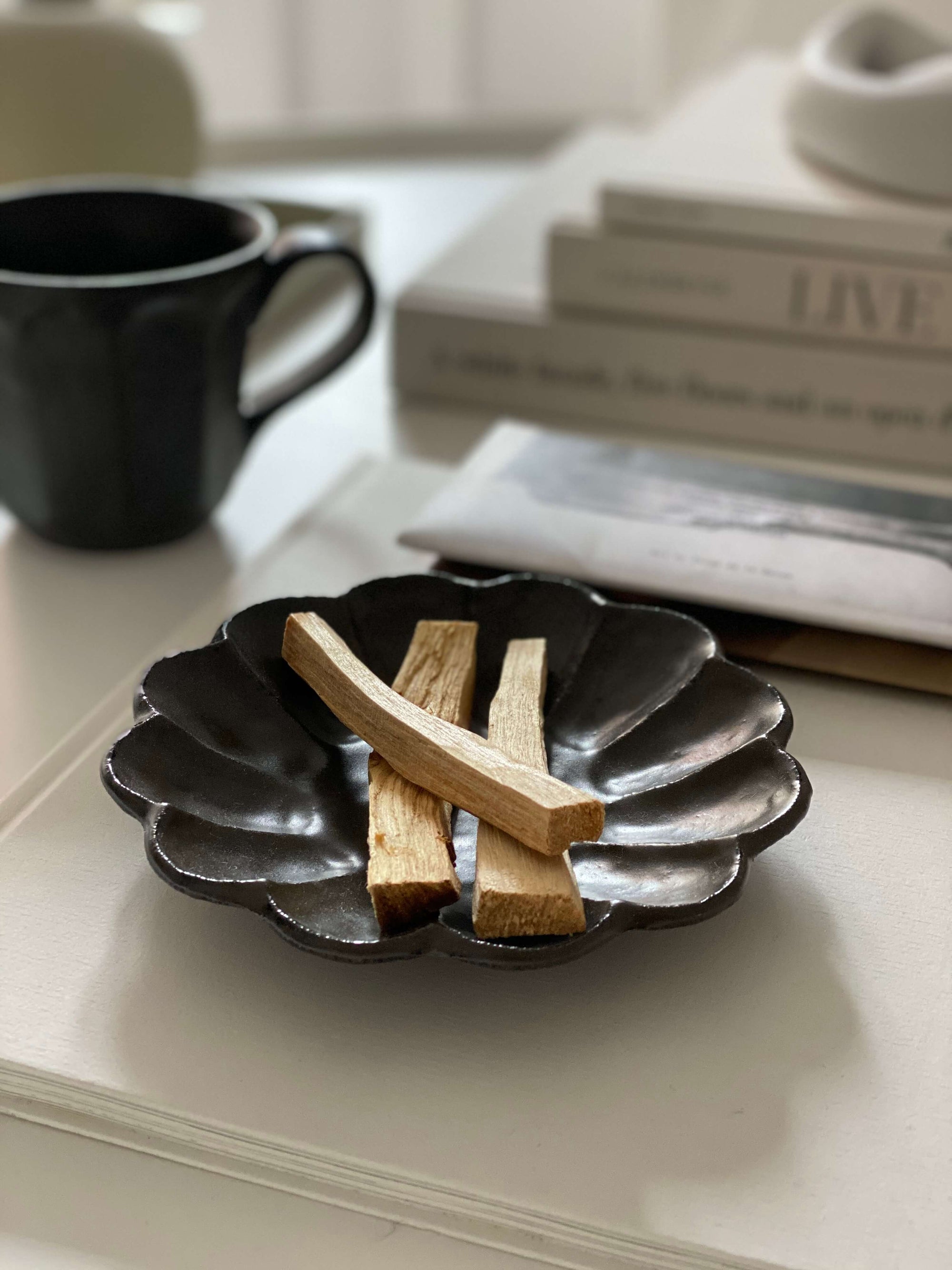 Elegant Rinka plate 14cm with wooden incense sticks, showcasing Japanese craftsmanship. Perfect for enhancing table aesthetics.