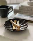 Elegant Rinka plate 14cm with wooden incense sticks, showcasing Japanese craftsmanship. Perfect for enhancing table aesthetics.