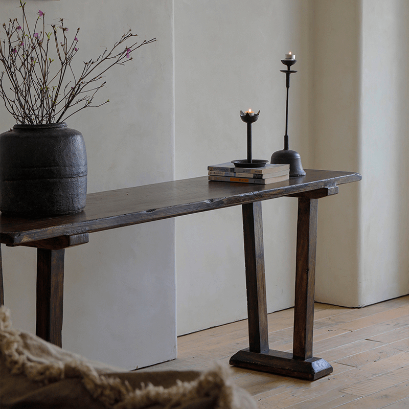Chinese-style entrance table made from 100% natural elm wood, featuring natural wood grain and elegant decor in a minimalist room.