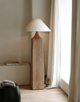 Elegant Stake Floor Lamp with linen shade and rustic wood base, featuring a dimmable switch for customizable cozy lighting.