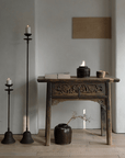 Antique Aimu Floor Candle Holder with Distressed Finish in Rustic Home Décor Setting