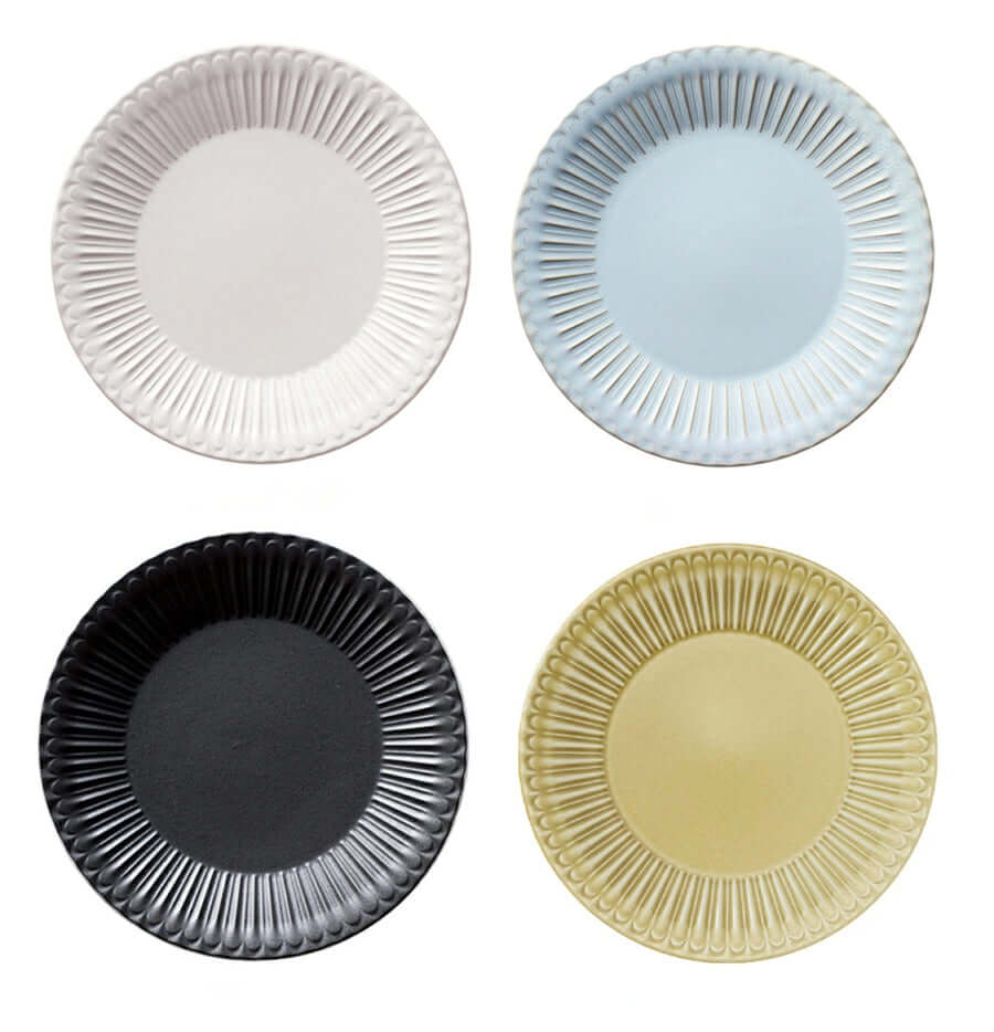 Four Storia Plates 24cm in white, blue, black, and yellow with elegant lace edges and lacquer finish, made from porcelain.