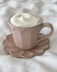 Rinka Mug & Plate Set with frothy drink, porcelain handmade in Japan, floral-shaped plate, beige finish, microwave and dishwasher safe.