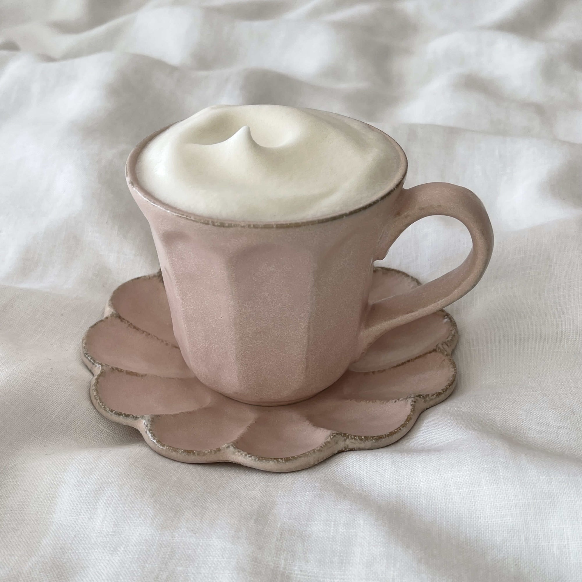 Rinka Mug & Plate Set with frothy drink, porcelain handmade in Japan, floral-shaped plate, beige finish, microwave and dishwasher safe.