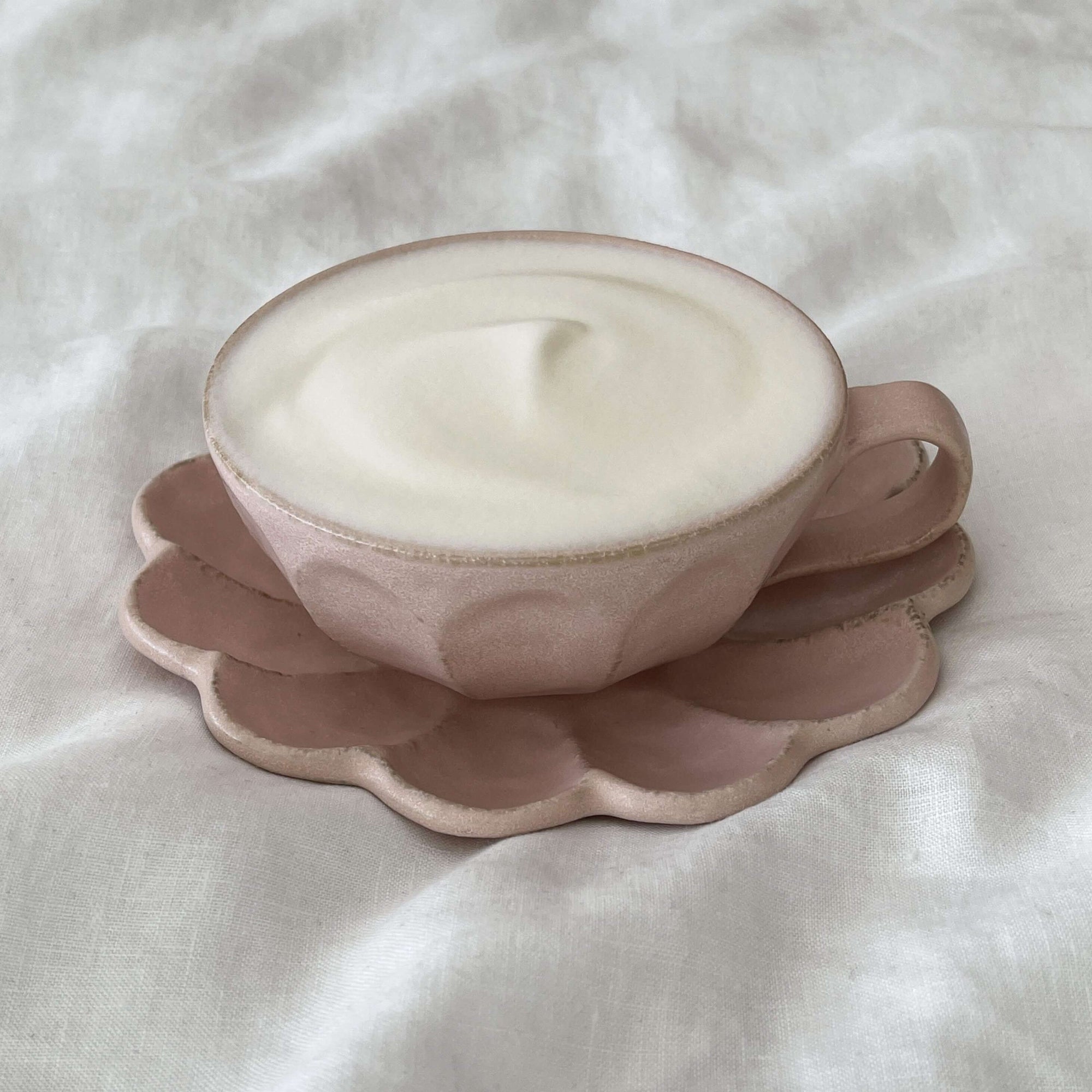 Pink Rinka soup cup with creamy foam on a matching flower-shaped plate made from delicate porcelain by Kaneko Kohyo.