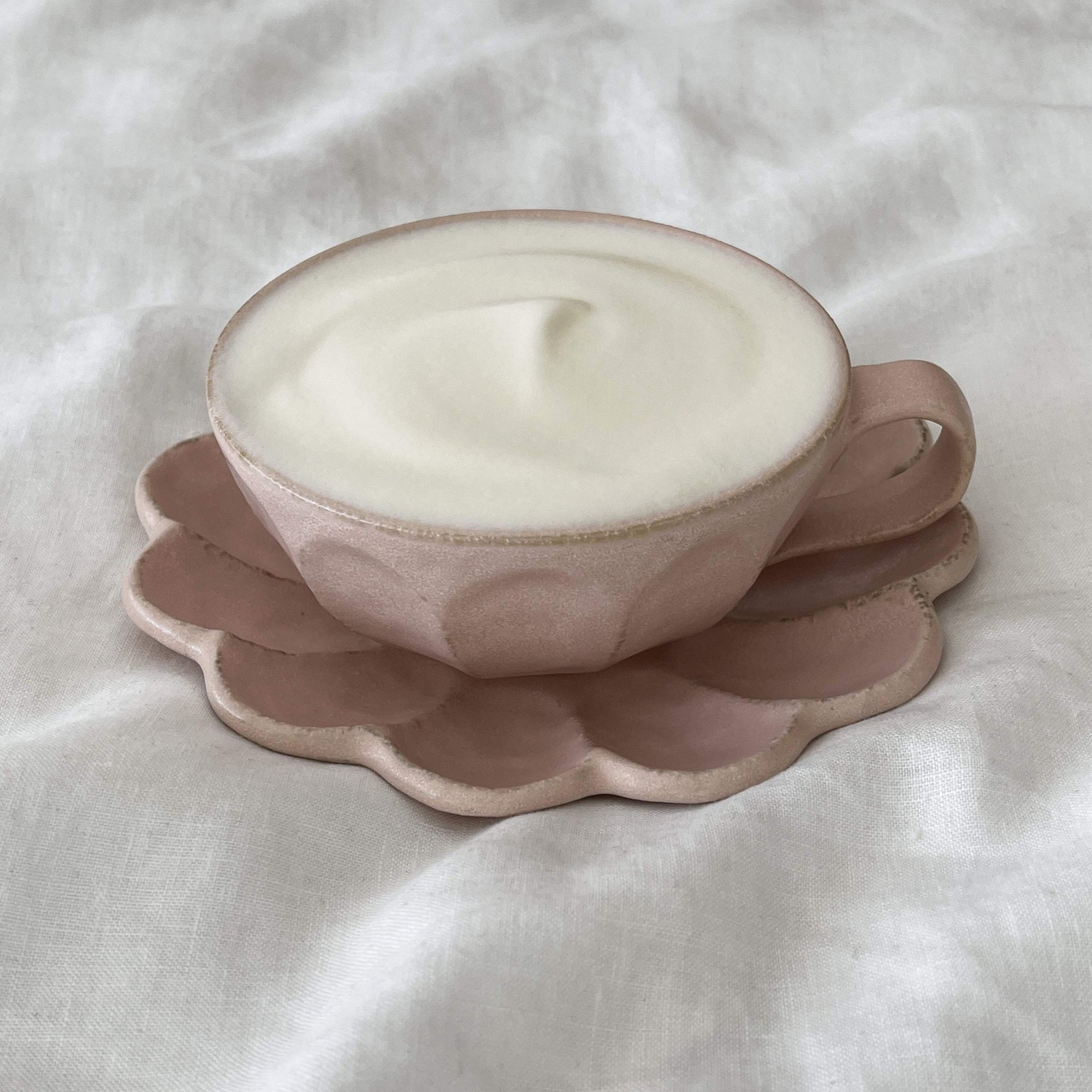 Rinka Soup Cup on scalloped porcelain saucer filled with creamy soup, showcasing elegant handcrafted design by Kaneko Kohyo.