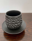Elegant Yoshida Pottery Shinogi Cup and Saucer with nature-inspired patterns, crafted by ceramist Masakazu Yoshida.