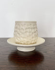 Elegant Shinogi Cup and Saucer Set by Masakazu Yoshida with nature-inspired design on dark wood table from Yoshida Pottery Collection.