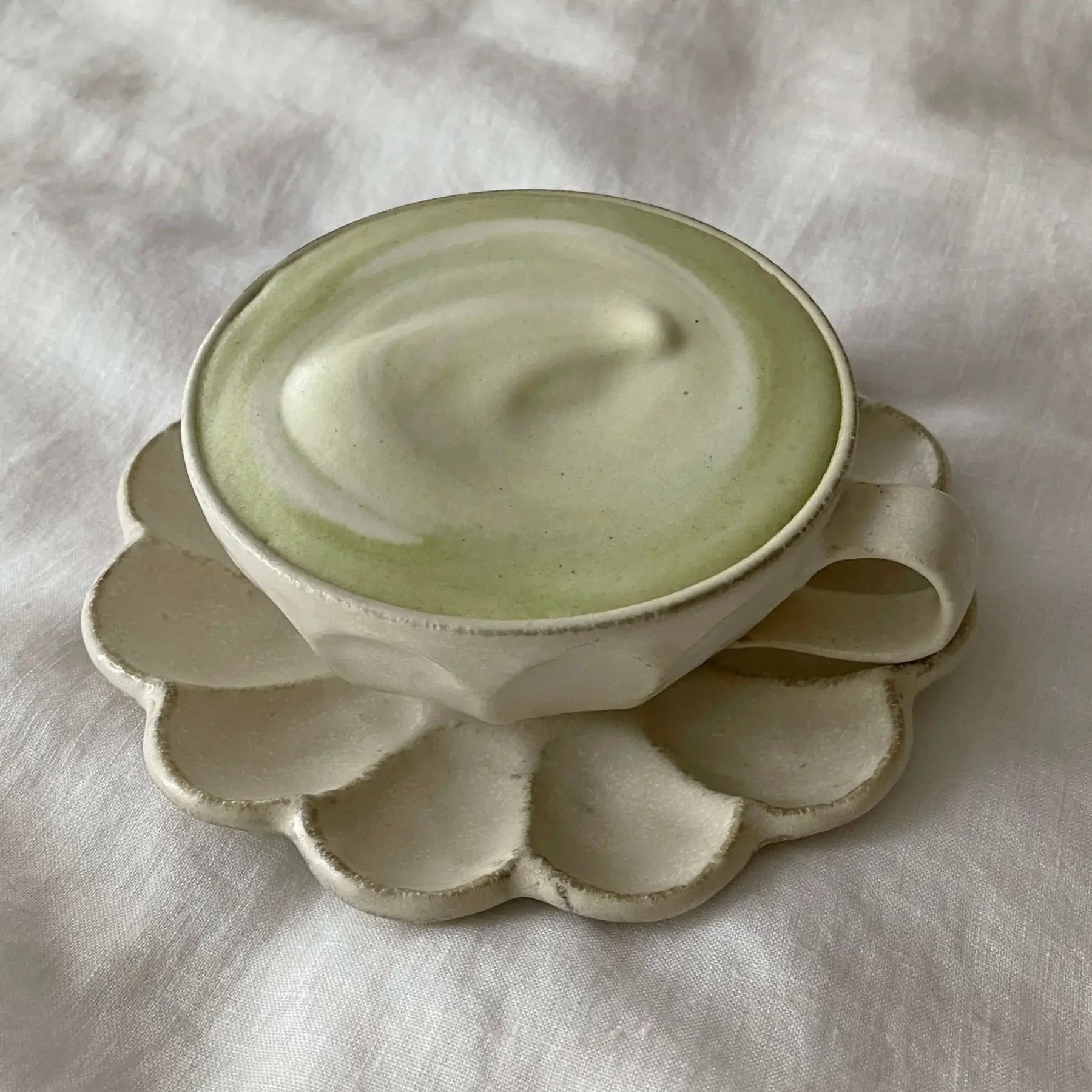 Rinka Soup Cup with matching 15cm plate on fabric background, elegant design for stylish dining and serving.