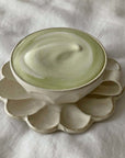 Rinka Soup Cup in white porcelain with flower-shaped plate, part of Kaneko Kohyo's handcrafted Rinka Collection, on a soft white background.