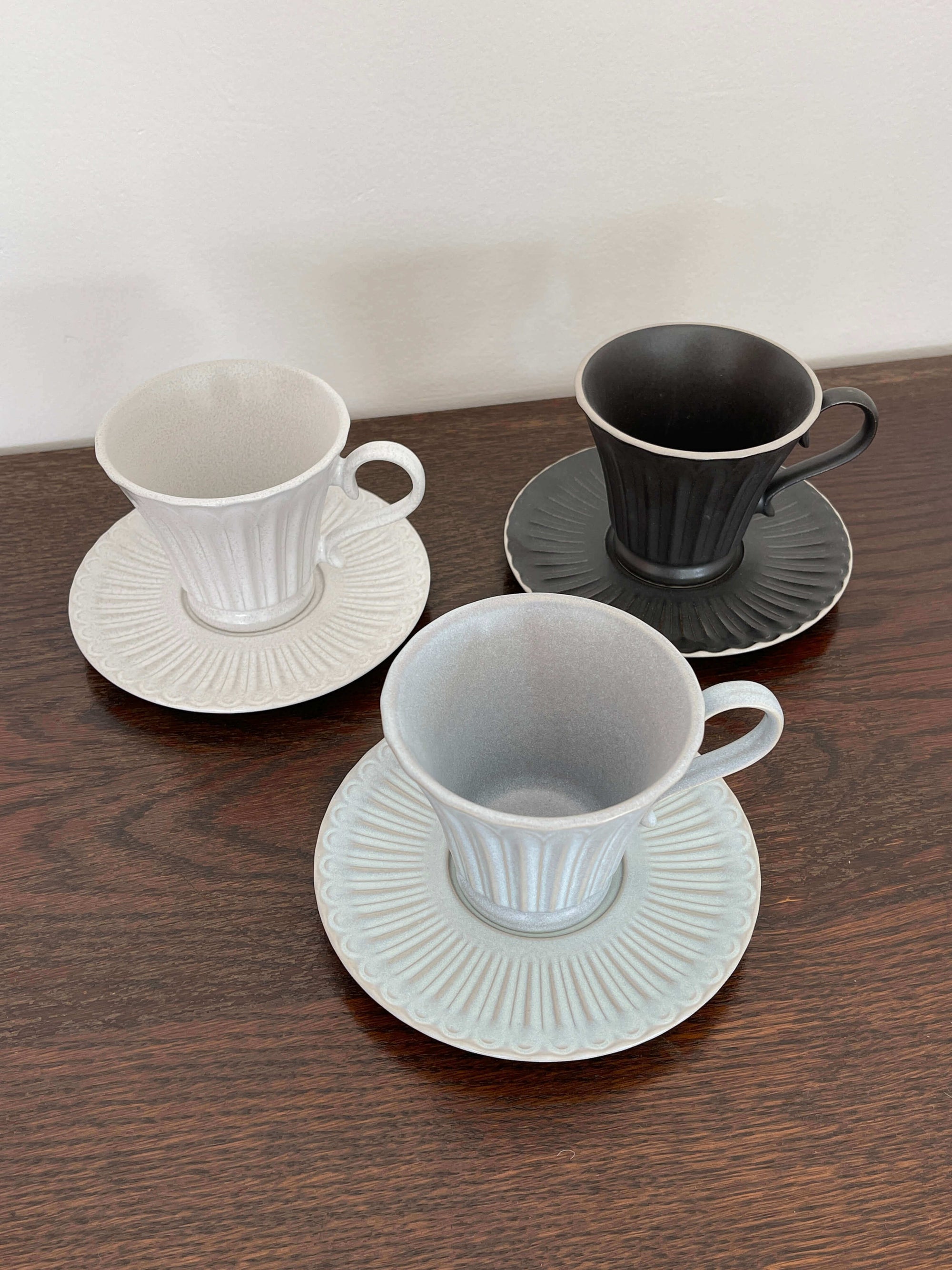 Storia Tall Coffee Cup & Saucer set with antique finish in white and black, elegant porcelain tableware from Japan.