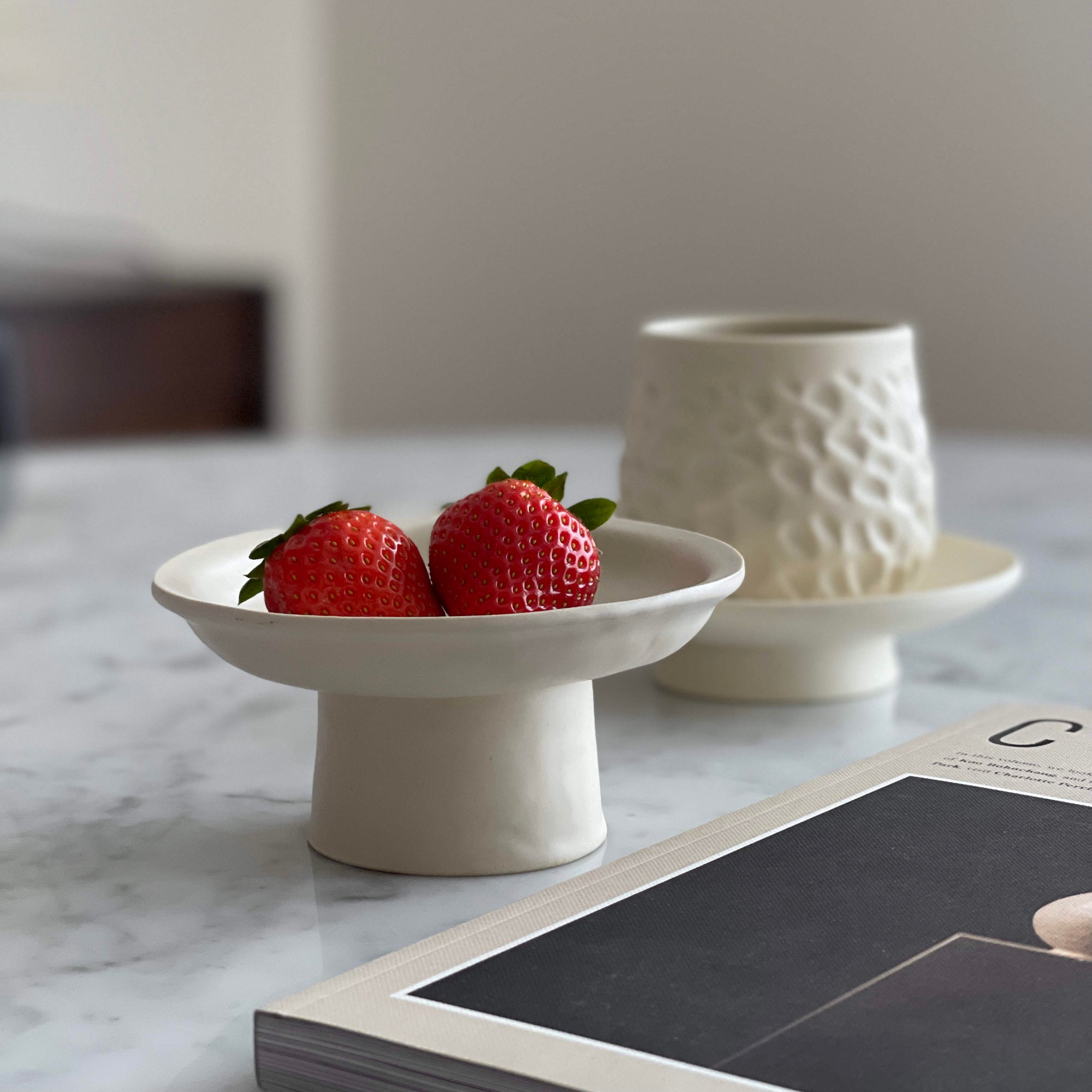 Tall Plate by Yoshida Pottery displaying strawberries on a marble table with an elegant, nature-inspired design.