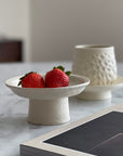 Tall Plate by Yoshida Pottery displaying strawberries on a marble table with an elegant, nature-inspired design.