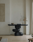 Wabi-Sabi creative living room porch table with unique irregular design and log countertops in a cozy, minimalist setting.
