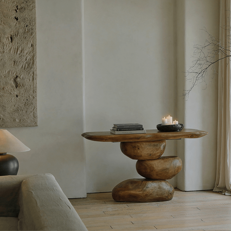 Wabi-Sabi living room porch table with irregular wood structure and candles, showcasing a retro nostalgic design with natural elements.