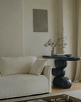 Minimalist living room with a Wabi-Sabi porch table made of natural wood, featuring a unique design with retro nostalgic elements.