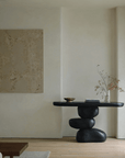 Wabi-sabi living room table with irregular structure, made of natural aging wooden logs, embodying retro nostalgic style.