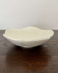 Elegant UME bowl from Yoshida Pottery Collection by Masakazu Yoshida, showcasing nature-inspired design on a wooden table.