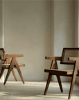 Chandigarh chairs in teak and rattan showcasing wabi-sabi design and Western minimalism for a peaceful, romantic ambiance.
