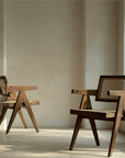 Chandigarh chairs in teak and rattan showcasing wabi-sabi design and Western minimalism for a peaceful, romantic ambiance.