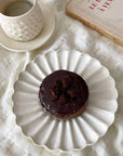"Rinka Plate by Yoshida Pottery with chocolate dessert and coffee, showcasing an elegant table setting"