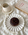 Elegant Shinogi cup set with coffee, chocolate dessert, and a book on a textured surface, creating a cozy, sophisticated vibe.