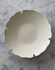 Yukiwa Plate by Yoshida Pottery with nature-inspired design on a marble surface. Elegant ceramic dishware by Masakazu Yoshida.