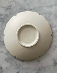 Yukiwa Plate by Yoshida Pottery, elegant ceramic plate inspired by nature, crafted by ceramist Masakazu Yoshida, on marble background.