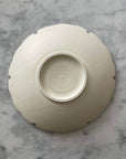 Yukiwa Plate by Yoshida Pottery, elegant ceramic plate inspired by nature, crafted by ceramist Masakazu Yoshida, on marble background.