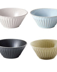 Four elegant Storia Bowls in white, blue, black, and beige porcelain with a textured design, evoking nostalgia and sophistication.