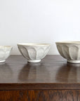 Handcrafted Rinka medium soup bowls in white porcelain, showcasing elegant flower shapes, perfect for enhancing table settings.